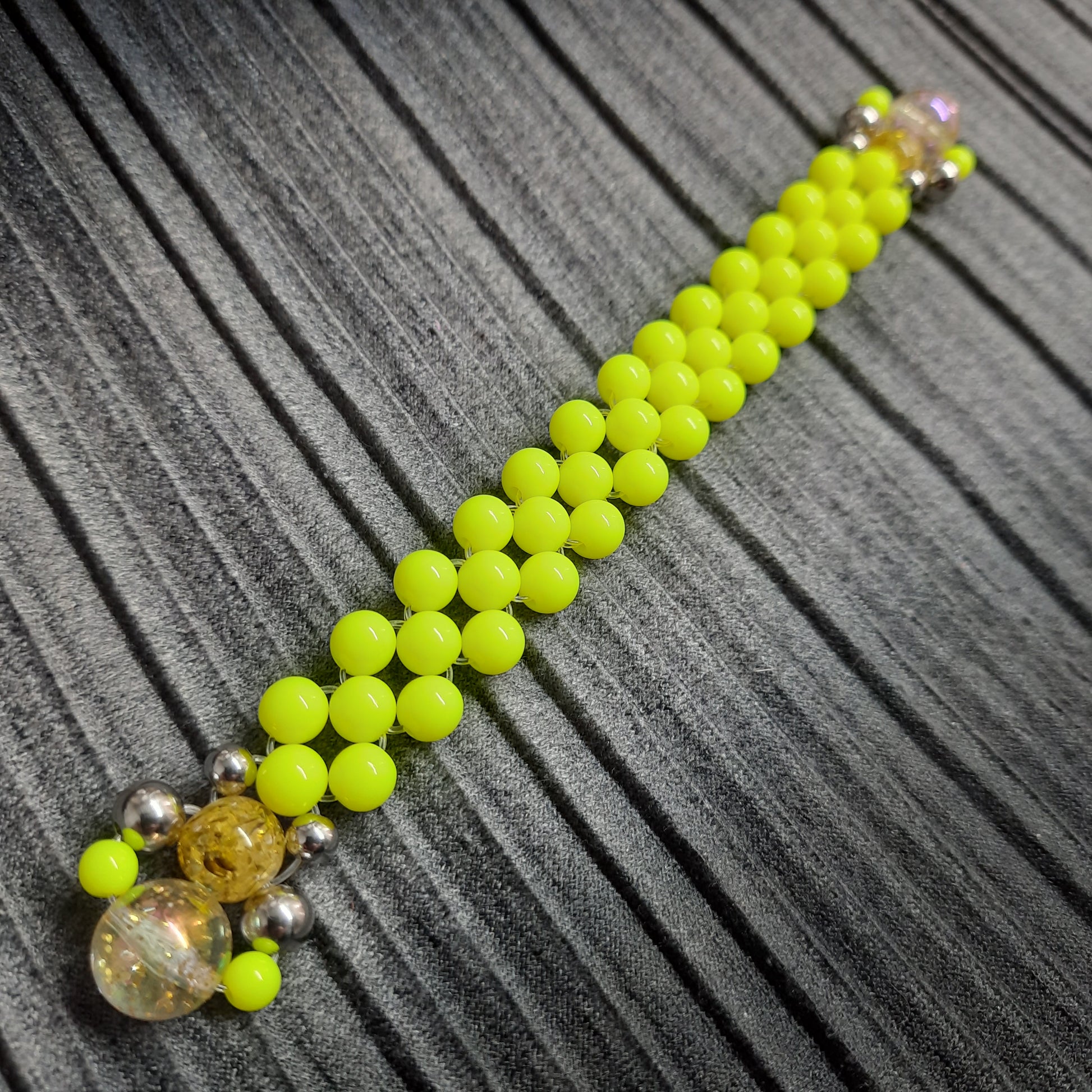 Handmade flip rosary (chetki), assembled from round plastic beads. The chotki has good flexibility thanks to the silicone cord. This fidget is used as an anti-stress, skill toy, stylish accessory and collectible.