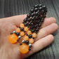 Handmade flip rosary (chetki), assembled from round plastic beads. The chotki has good flexibility thanks to the silicone cord. This fidget is used as an anti-stress, skill toy, stylish accessory and collectible.