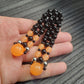 Handmade flip rosary (chetki), assembled from round plastic beads. The chotki has good flexibility thanks to the silicone cord. This fidget is used as an anti-stress, skill toy, stylish accessory and collectible.