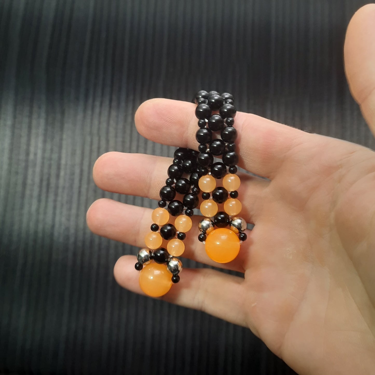 Handmade flip rosary (chetki), assembled from round plastic beads. The chotki has good flexibility thanks to the silicone cord. This fidget is used as an anti-stress, skill toy, stylish accessory and collectible.