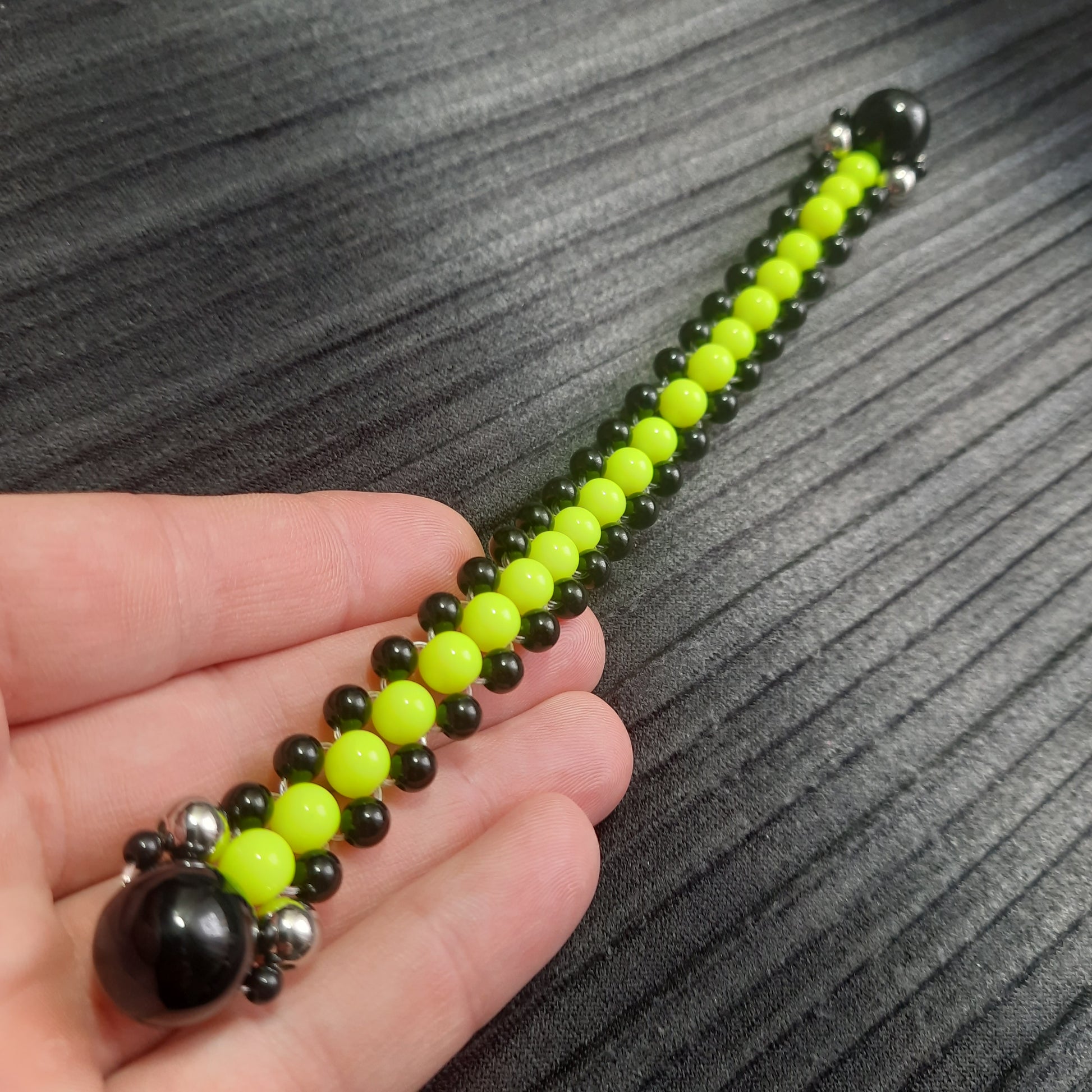 Handmade flip rosary (chetki), assembled from round plastic beads. The chotki has good flexibility thanks to the silicone cord. This fidget is used as an anti-stress, skill toy, stylish accessory and collectible.