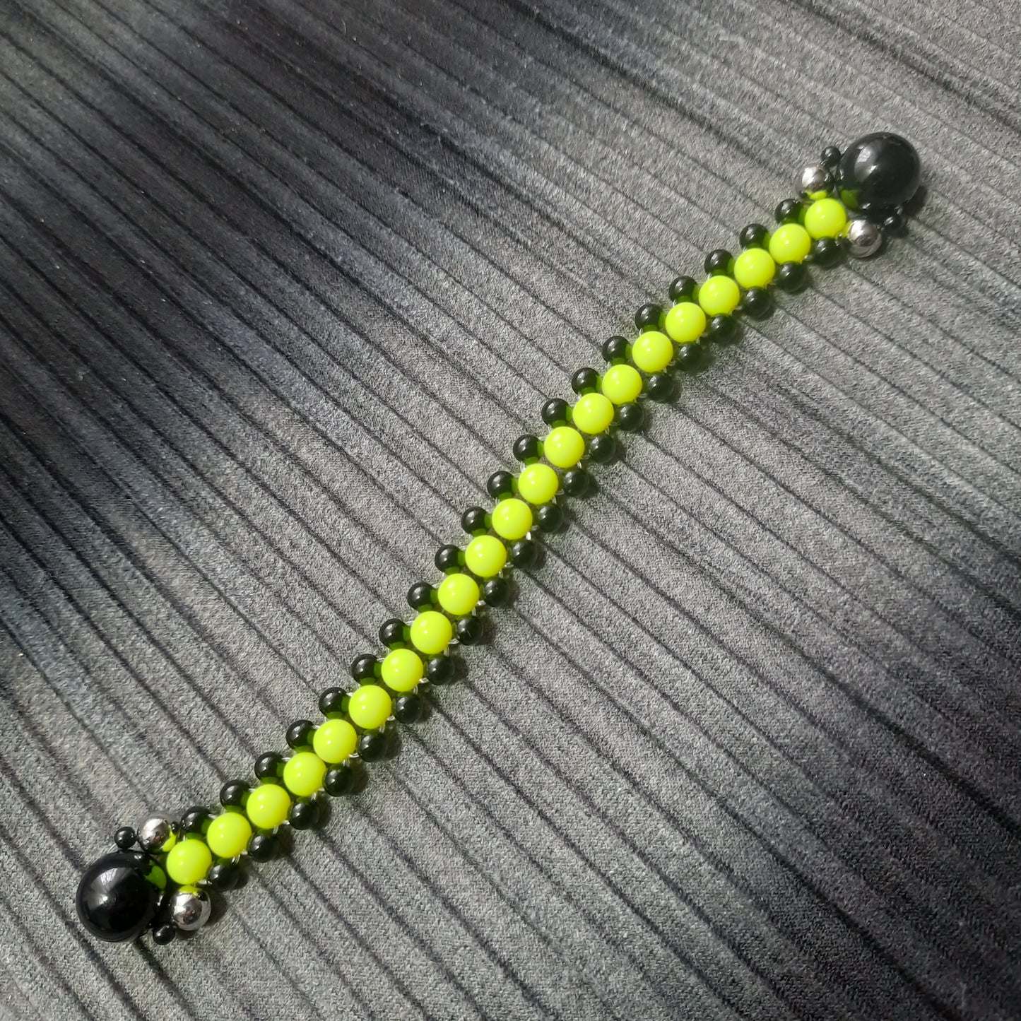 Handmade flip rosary (chetki), assembled from round plastic beads. The chotki has good flexibility thanks to the silicone cord. This fidget is used as an anti-stress, skill toy, stylish accessory and collectible.