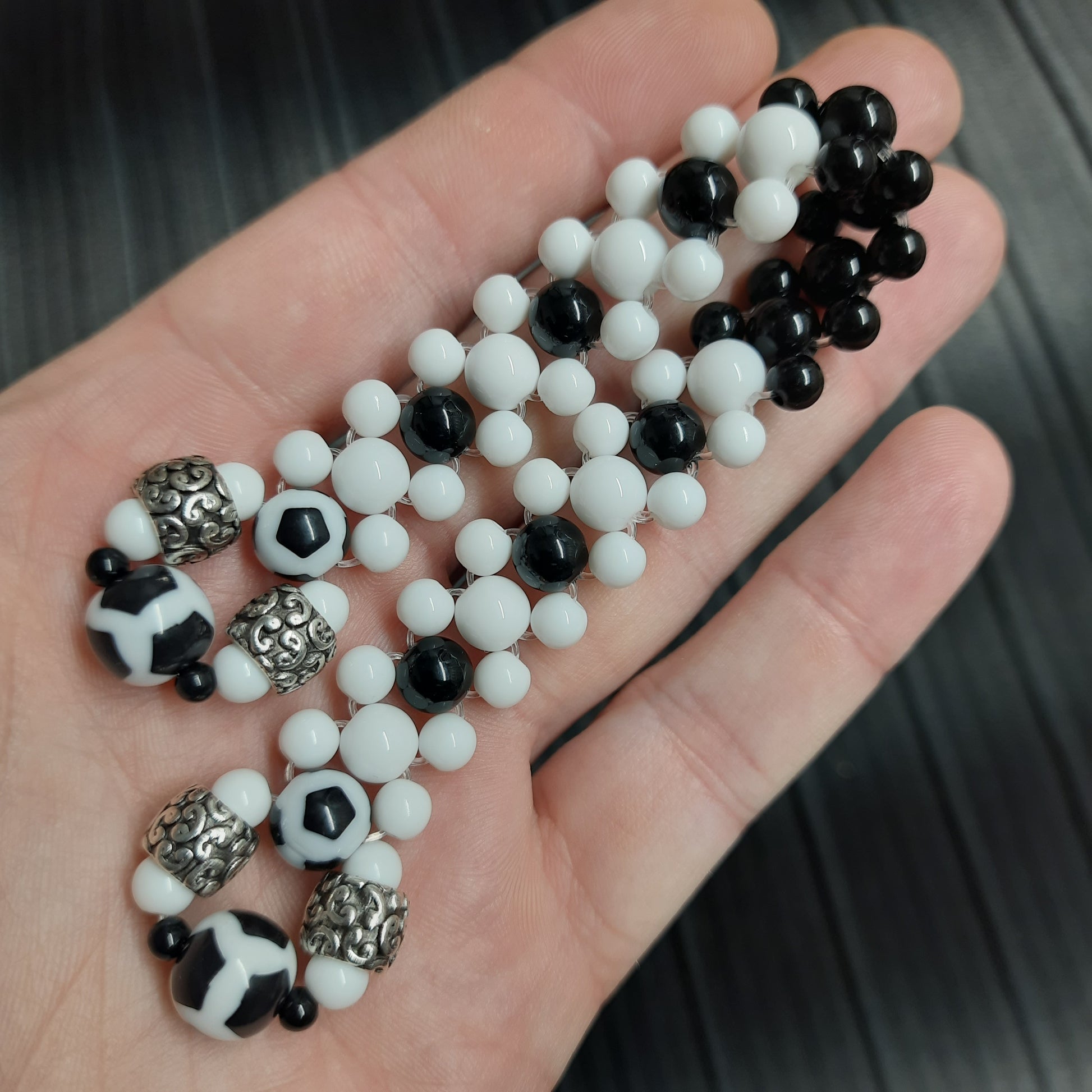 Handmade flip rosary (chetki), assembled from round plastic beads. The chotki has good flexibility thanks to the silicone cord. This fidget is used as an anti-stress, skill toy, stylish accessory and collectible.