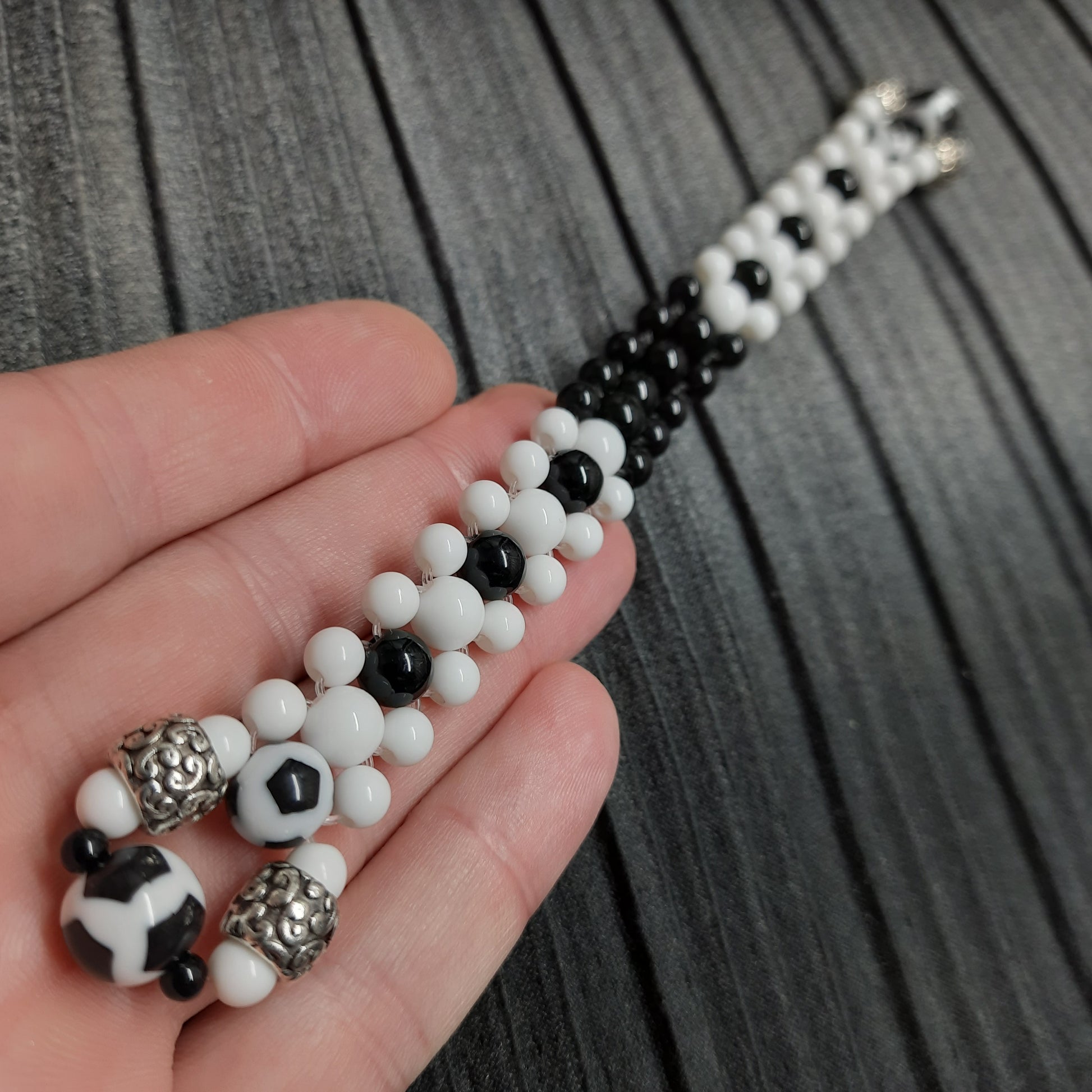 Handmade flip rosary (chetki), assembled from round plastic beads. The chotki has good flexibility thanks to the silicone cord. This fidget is used as an anti-stress, skill toy, stylish accessory and collectible.