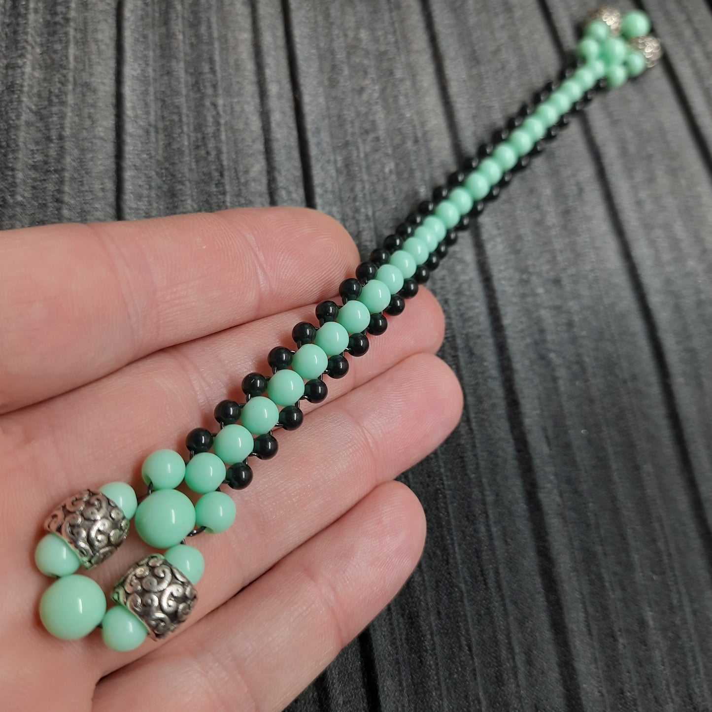 Handmade flip rosary (chetki), assembled from round plastic beads. The chotki has good flexibility thanks to the silicone cord. This fidget is used as an anti-stress, skill toy, stylish accessory and collectible.