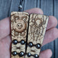 Wooden flat flip-over rosary (chetki) with a pattern applied using pyrography. Handmade rosary. Kevlar cord is used.