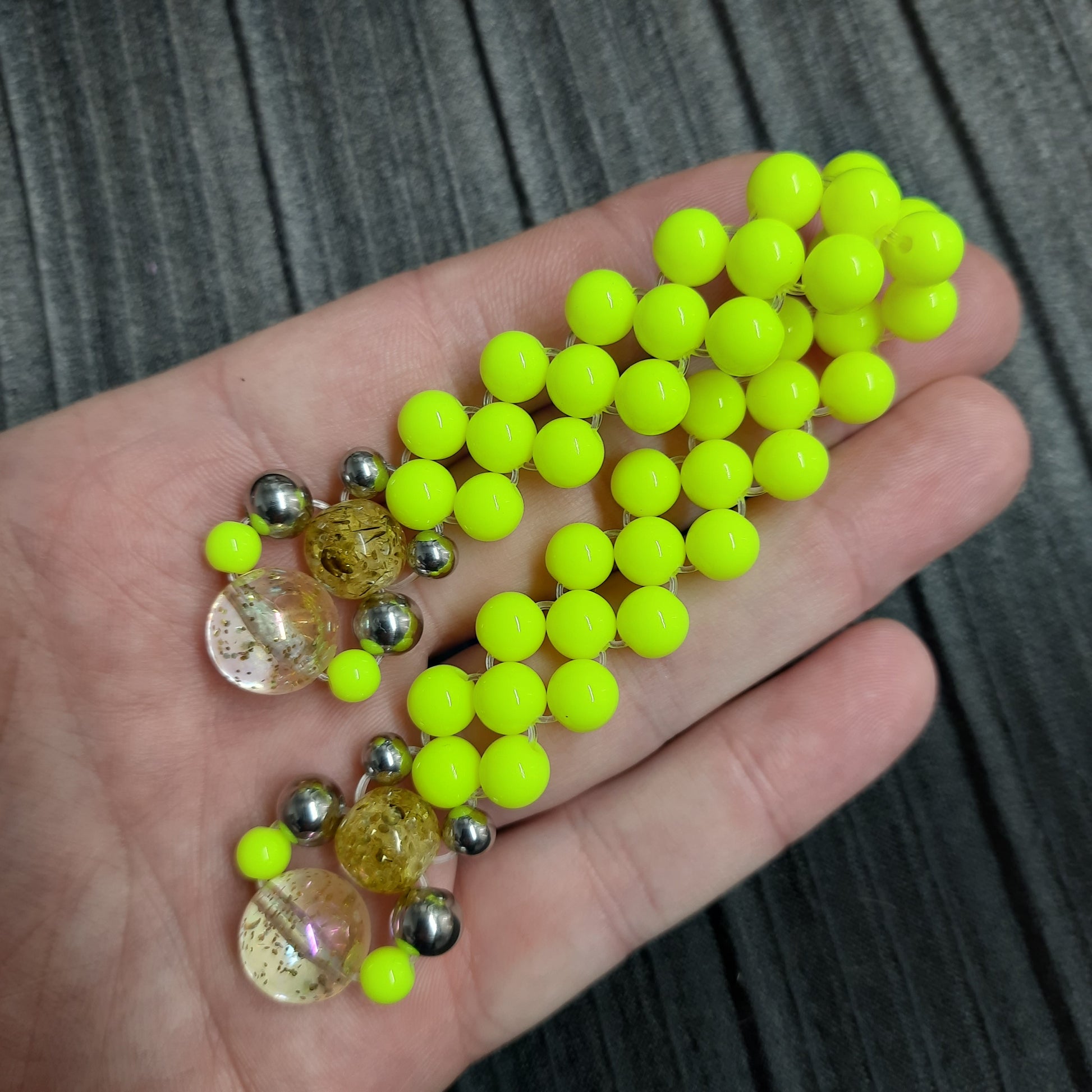 Handmade flip rosary (chetki), assembled from round plastic beads. The chotki has good flexibility thanks to the silicone cord. This fidget is used as an anti-stress, skill toy, stylish accessory and collectible.