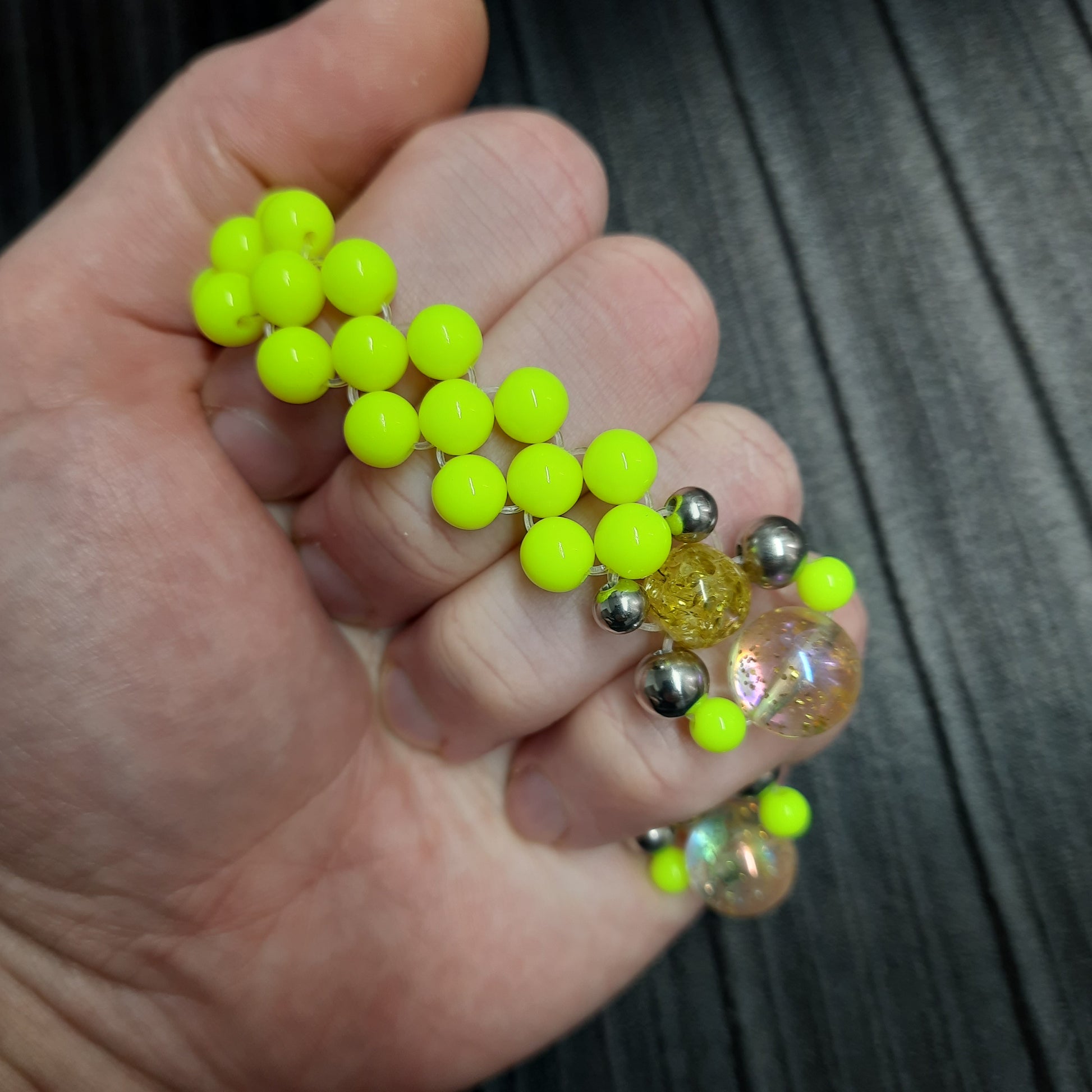 Handmade flip rosary (chetki), assembled from round plastic beads. The chotki has good flexibility thanks to the silicone cord. This fidget is used as an anti-stress, skill toy, stylish accessory and collectible.