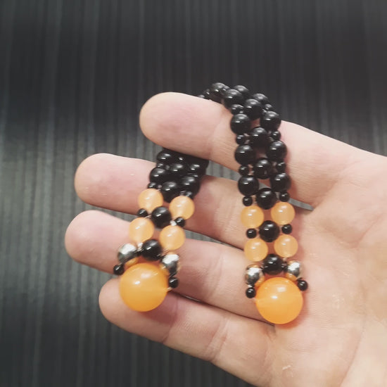 Handmade flip rosary (chetki), assembled from round plastic beads. The chotki has good flexibility thanks to the silicone cord. This fidget is used as an anti-stress, skill toy, stylish accessory and collectible.